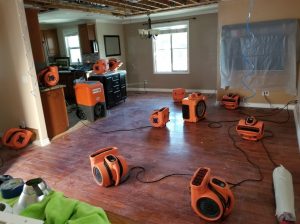 Water Damage Restoration In A Flooded Living Room